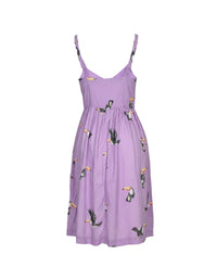 Purple dress with bird pattern on a white background