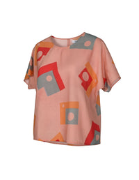 Pink blouse with geometric pattern on a white background