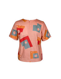 Short-sleeve shirt with geometric pattern on a white background