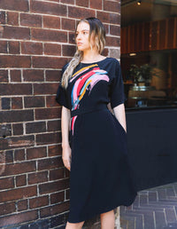 Annie dress Electric Heart printed 100% Silk with a tie belt. Slinky shift dress. Black with printed front. Front view
