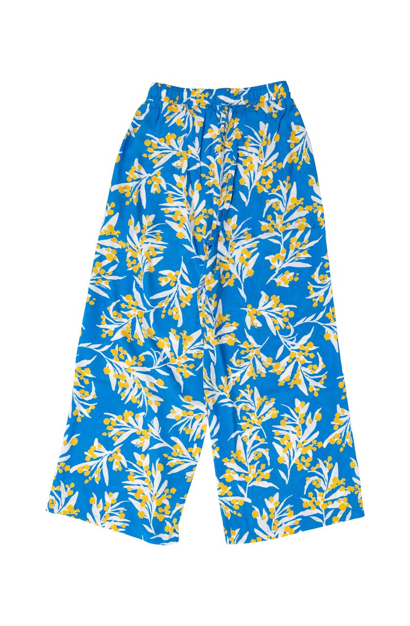 DEVOI Stevie pants in our Blue Wattle print. 100% Modal. Hand painted print.  Back flat lay view