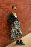 Printed linen skirt in a green pebbles print. Midi length with pocket and an elasticated waistband.