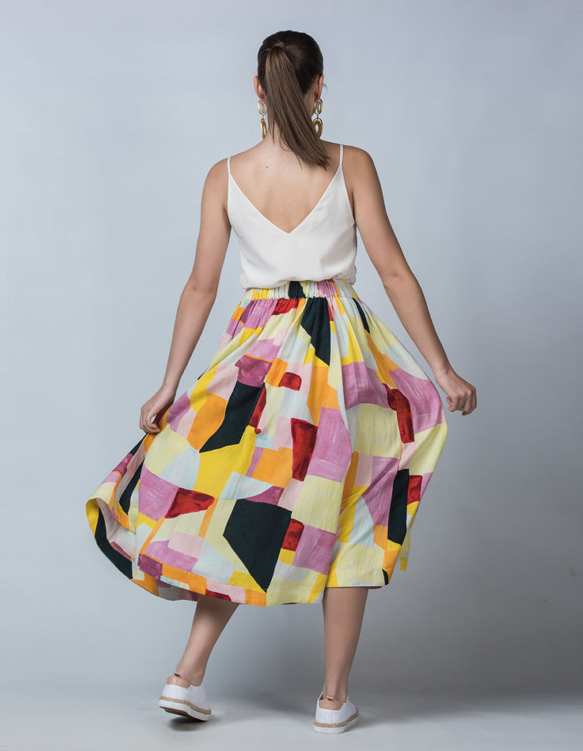 DEVOI Kathleen skirt in the Patchwork printed linen. Elasticated waistband, pockets. Midi length. Back view