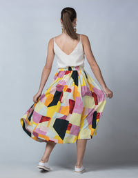 DEVOI Kathleen skirt in the Patchwork printed linen. Elasticated waistband, pockets. Midi length. Back view