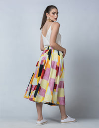 DEVOI Kathleen skirt in the Patchwork printed linen. Elasticated waistband, pockets. Midi length. Side back view