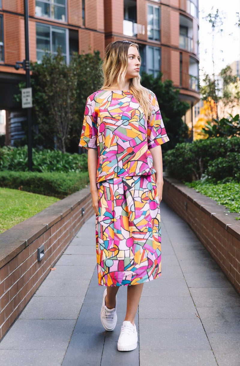 DEVOI Rejoice printed Modal skirt. Elasticated back waist. Flat front waist. Pockts! Finishes just below the knee. Seen on model. Front view