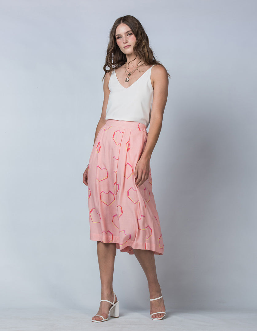 DEVOI Pink Neon Heart printed Margot skirt in modal crepe. Side Front view on model