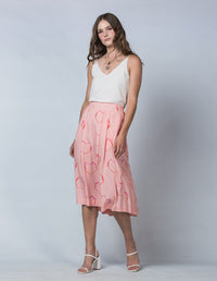 DEVOI Pink Neon Heart printed Margot skirt in modal crepe. Side Front view on model