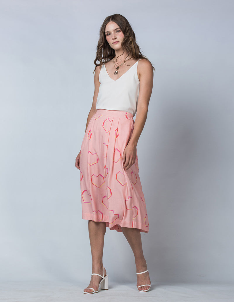 DEVOI Pink Neon Heart printed Margot skirt in modal crepe. Side Front view on model