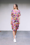 DEVOI Annie dress in Rejoice printed Modal. Belted at the waist and has side pockets! Front view on model.