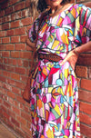 DEVOI Annie dress in Rejoice printed Modal. Belted at the waist and has side pockets! Side view on model