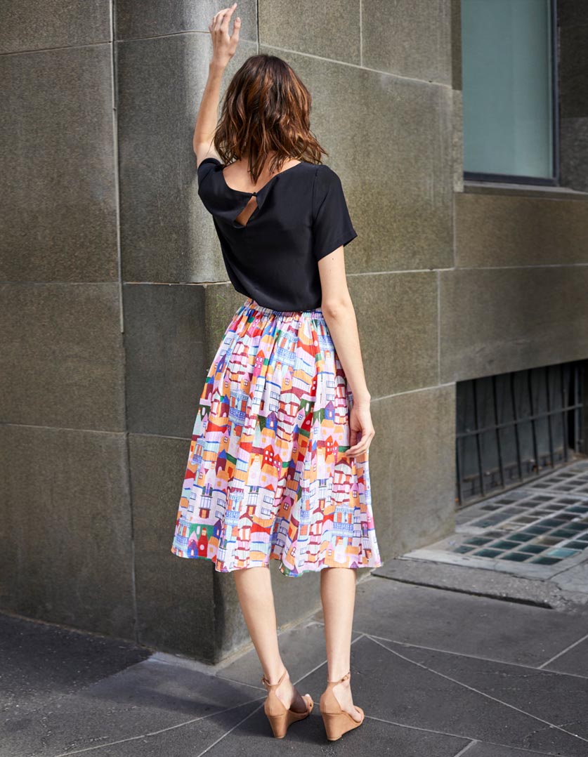 DEVOI Kathleen skirt in Urban Scapes print. Front view. 100% Linen, hand painted print. Back view