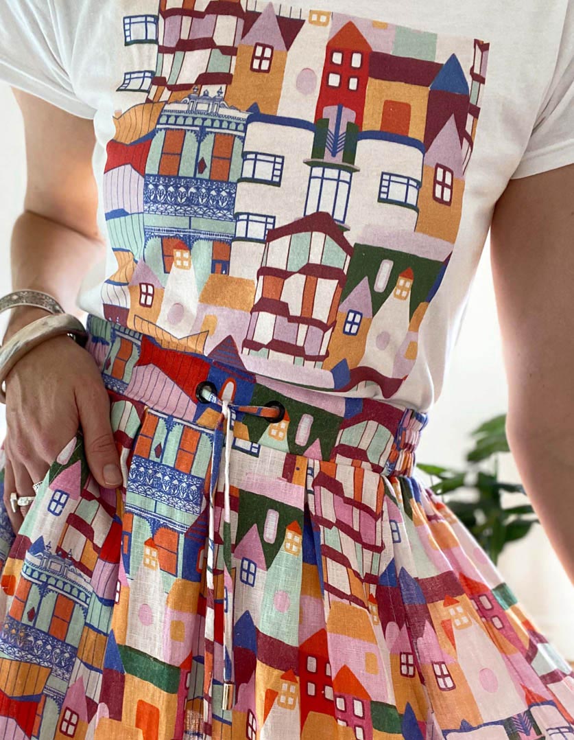 DEVOI Kathleen skirt in Urban Scapes print. Front view. 100% Linen, hand painted print. Close-up