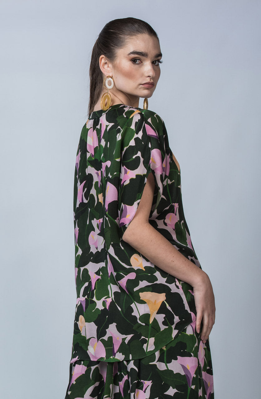 DEVOI Cate top in Purple Calla Lilies printed cupro, vegan silk. Green and floral print. Floaty blouse with a round neck collar and hidden button placket.
