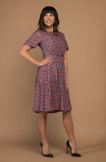 DEVOI Dorothy dress in Purple Leopard. The Dorothy is a linen-mix dress with a crew neck and gathering at the side waist seam at front and back. The dress has side-seam pockets! and is fastened at the back with an invisible zip and hook & eye.  The dress bodice is lined. 