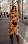 DEVOI Dorothy dress in cotton cord. Printed in Jugs print. Orange and grey colours. Round neckline and gathering at the waist. Front view