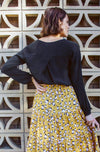 DEVOI Everleigh top in black viscose. Long sleeved top with a v-neck, and long sleeves with gathering at the cuff. Elegant black blouse.