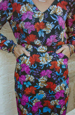 DEVOI Frances pencil skirt in stretch cotton. This skirt is printed in Black Empress floral print. the skirt is super comfy and has pockets and a back vent.