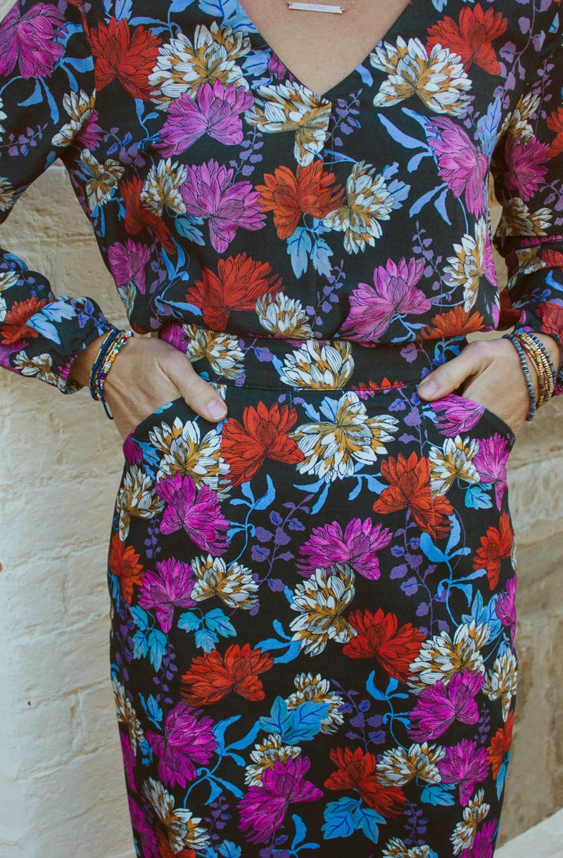 DEVOI Frances pencil skirt in stretch cotton. This skirt is printed in Black Empress floral print. the skirt is super comfy and has pockets and a back vent.